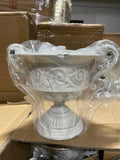 8.5” high White urn METAL with pattern in the middle