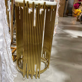 Table round stand (gold plinth) beside Backdrop